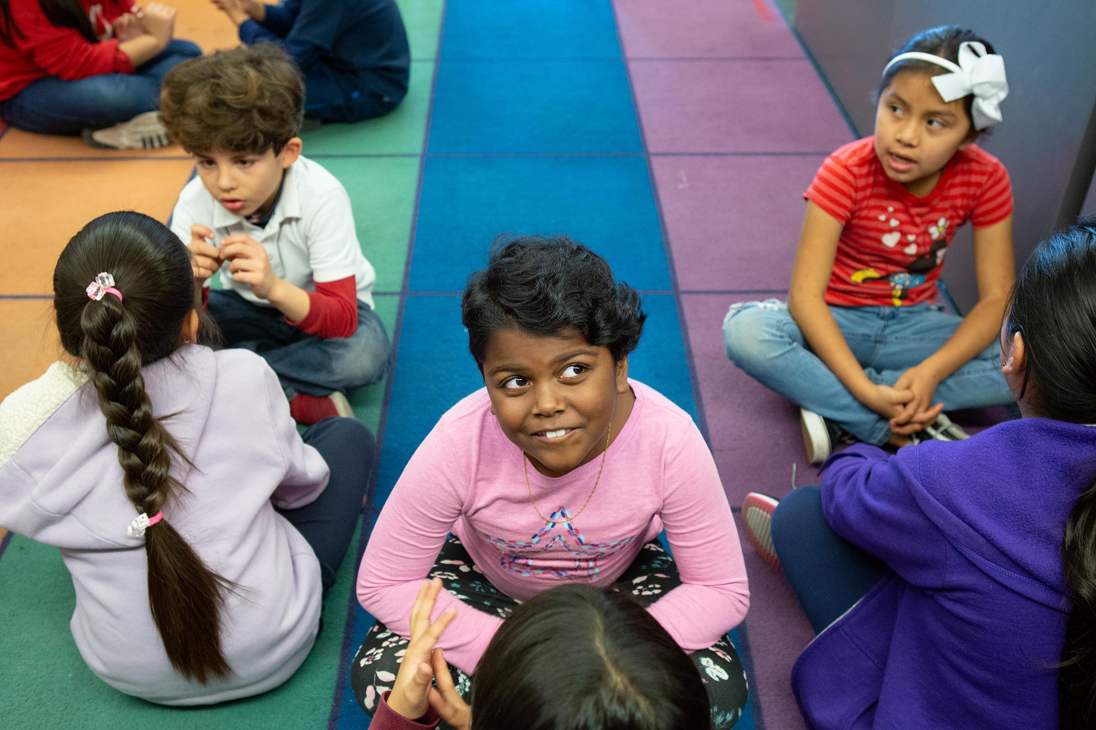 Second- and third-grade students talking